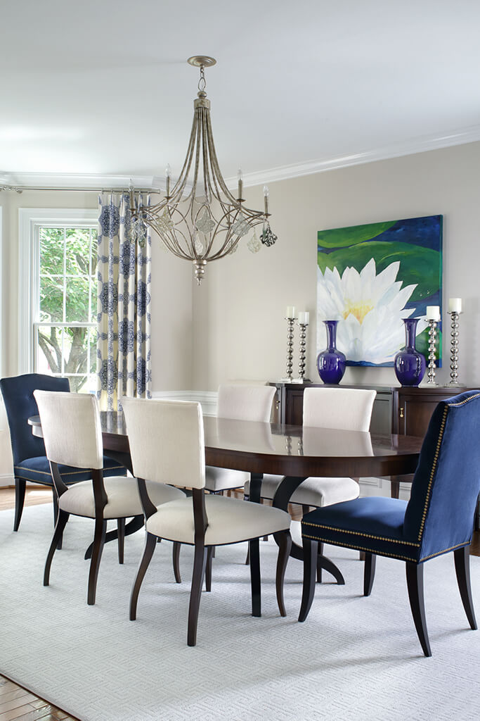 Kitchen table with purple chairs and purple vases